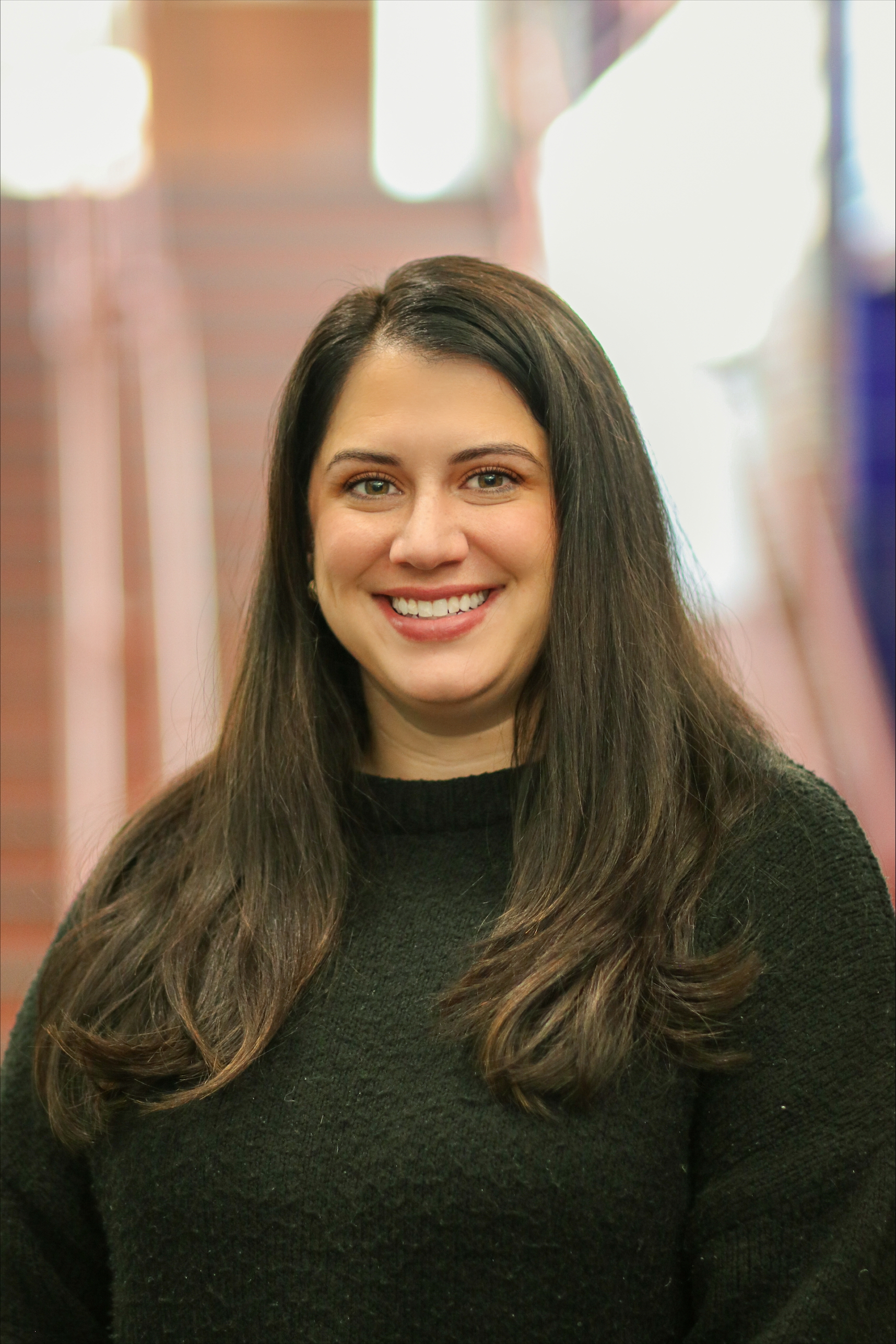 Jamie Jackson, a white woman with dark hair, in a black sweater